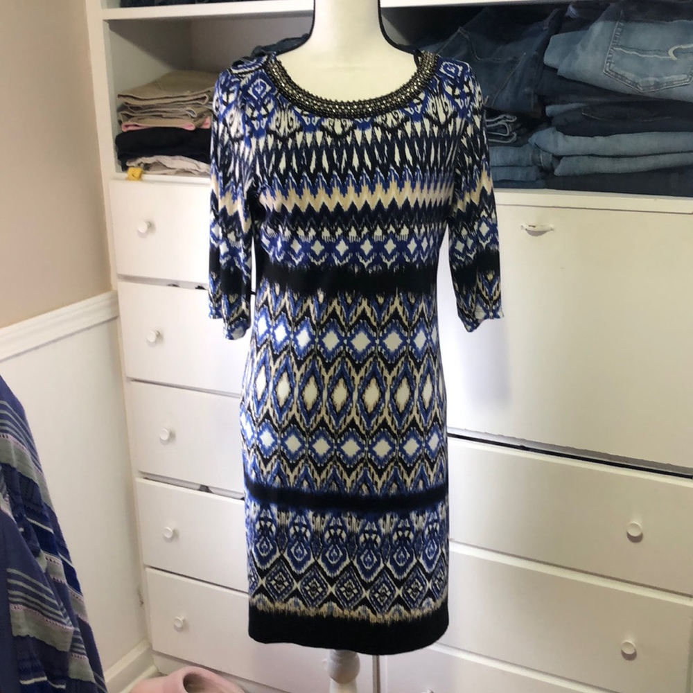 Pretty dress with beading detail around neck.